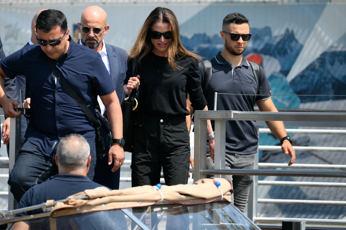 Jordan's Queen Rania prepares to board a taxi boat after landing at Venice Marco Polo airport ahead of Jeff Bezos' wedding on June 26, 2025. Celebrities in superyachts sail into Venice this week for the three-day wedding party of Amazon tycoon Jeff Bezos and Lauren Sanchez, despite irate locals who say the UNESCO city is no billionaire's playground. The tech magnate and journalist have reportedly invited about 200 guests to their multi-million dollar nuptials in the Italian city, which are expected to kick off on June 26 and end Saturday with a ceremony at a secret location. (Photo by Marco BERTORELLO / AFP) (Photo by MARCO BERTORELLO/AFP via Getty Images)          