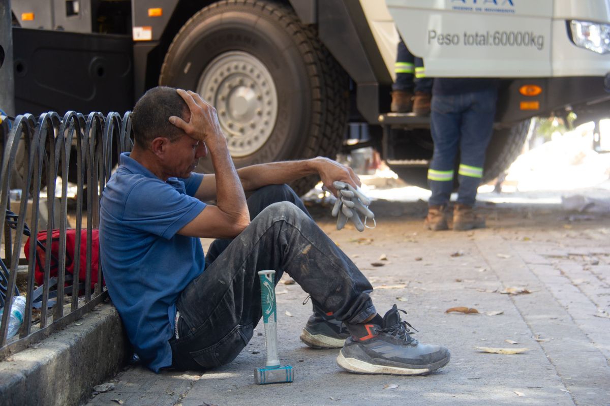 A man rests near the site of earthquake damage following a powerful magnitude 7.4 earthquake in Pereira, Colombia, on August 10, 2026.