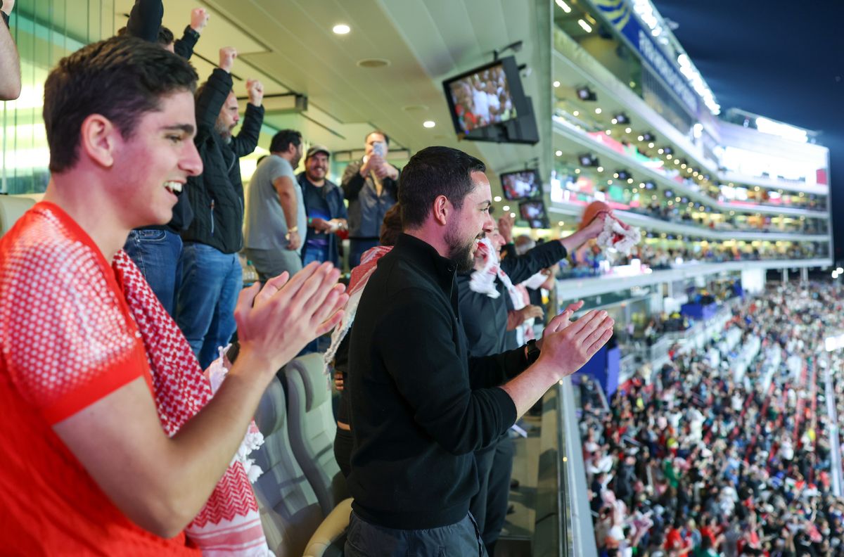 Crown Prince Hussein celebrates with Jordanian fans during the country's FIFA World Cup debut match.
