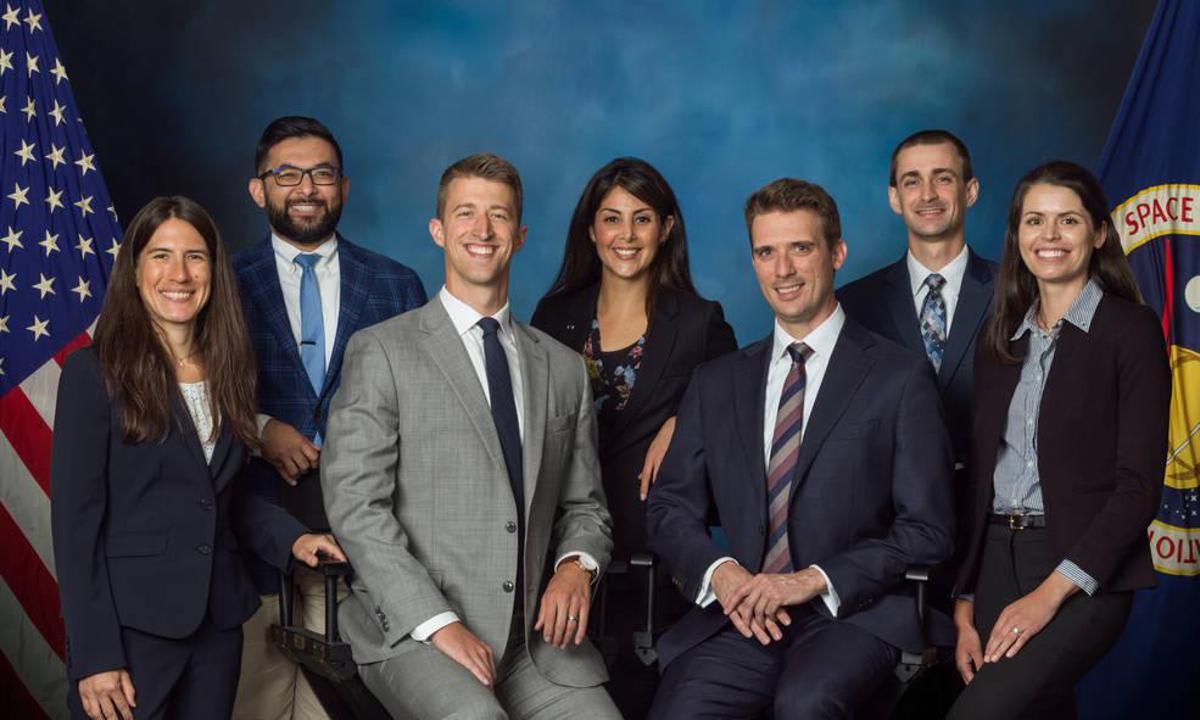A photo of NASA’s 2022 class of flight directors who will oversee operations of the International Space Station, commercial crew, and Artemis missions to the Moon. The inductees from left to right: Heidi Brewer, Ronak Dave, Garrett Hehn, Diana Trujillo, Elias Myrmo, Chris Dobbins, Nicole McElroy.