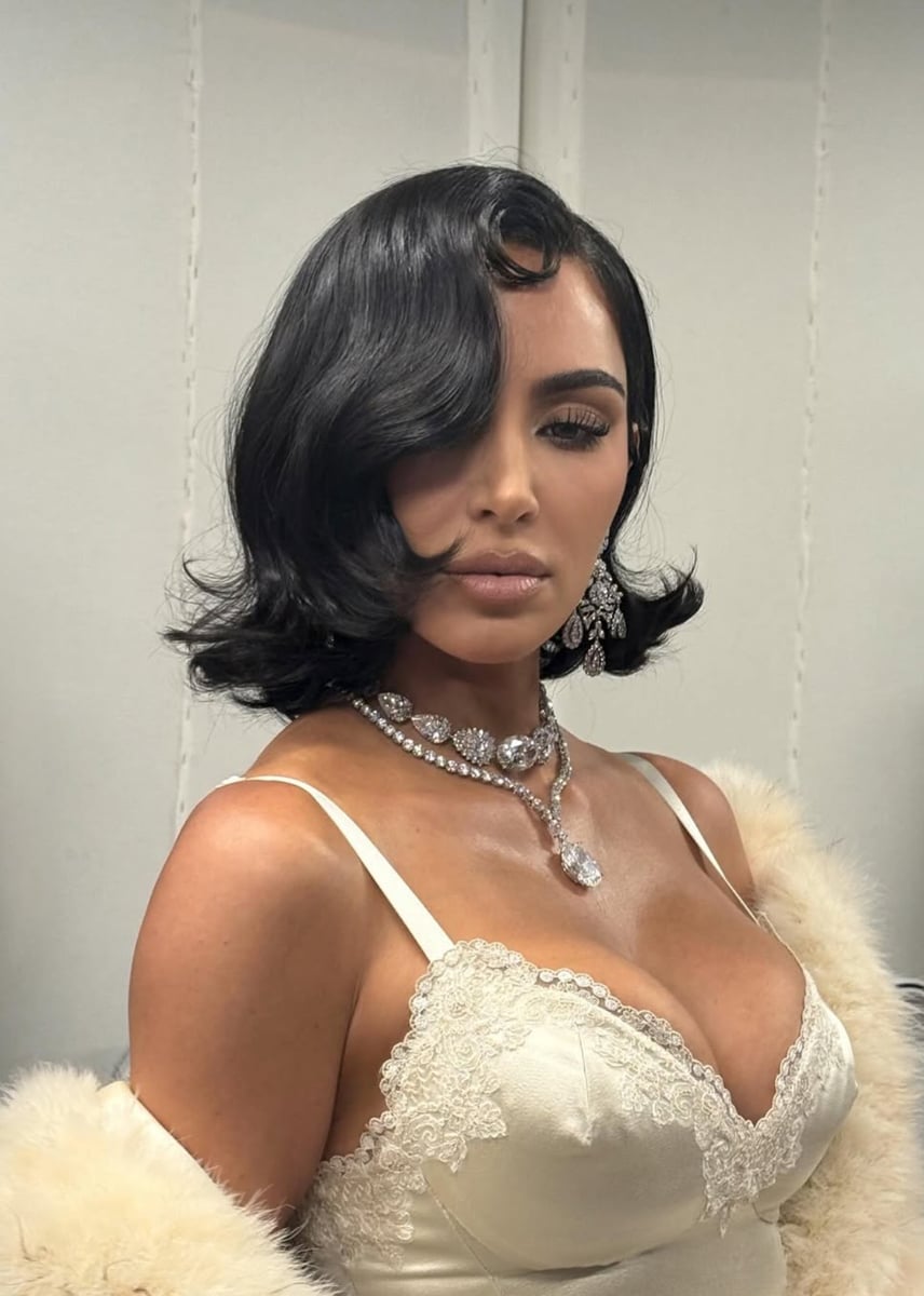 Kim Kardashian poses in Elizabeth Taylor's personal earrings