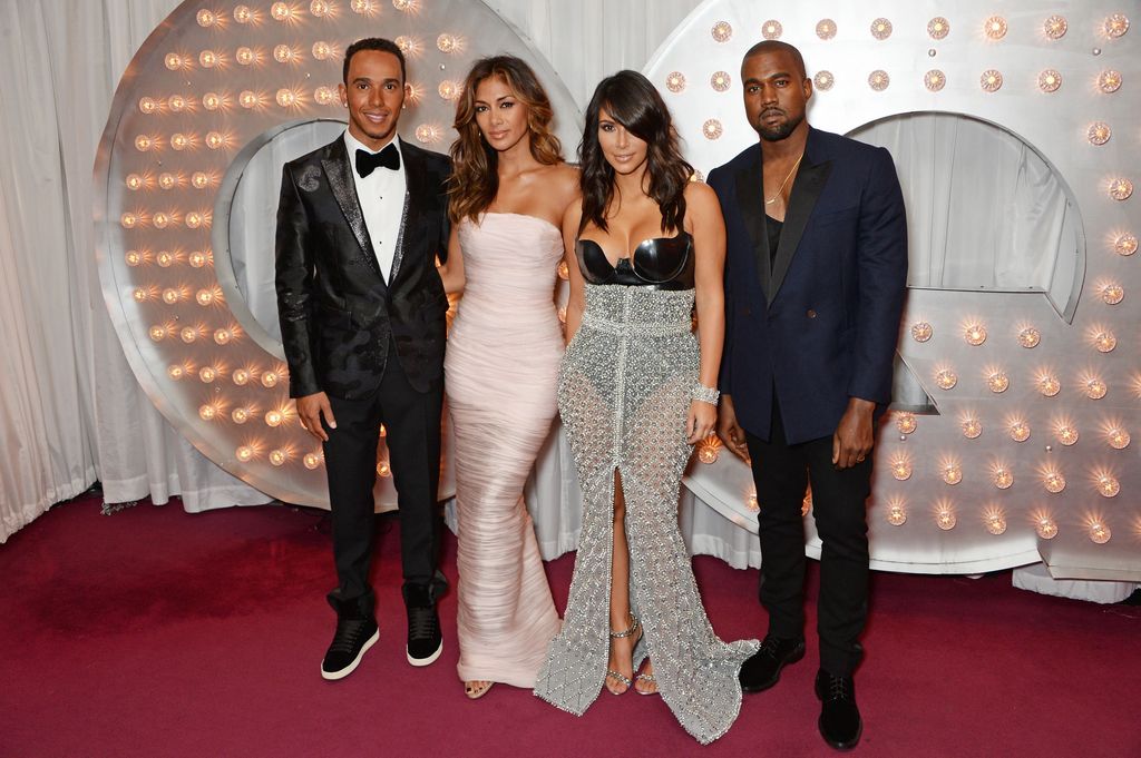 From left to right: Lewis Hamilton, Nicole Scherzinger, Kim Kardashian and Kanye West at the GQ Men of the Year Awards, in London at The Royal Opera House, in September 2014.
