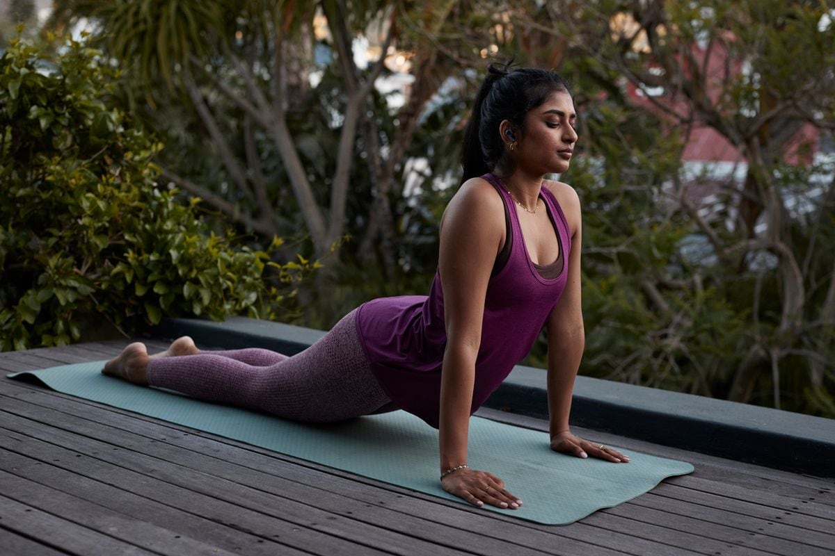 Woman practicing cobra pose yoga