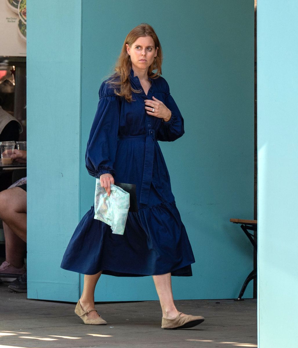 Princess Beatrice stepped out in central London wearing a navy belted midi dress and Mary Jane flats during a shopping trip to Fortnum & Mason ahead of her 38th birthday.