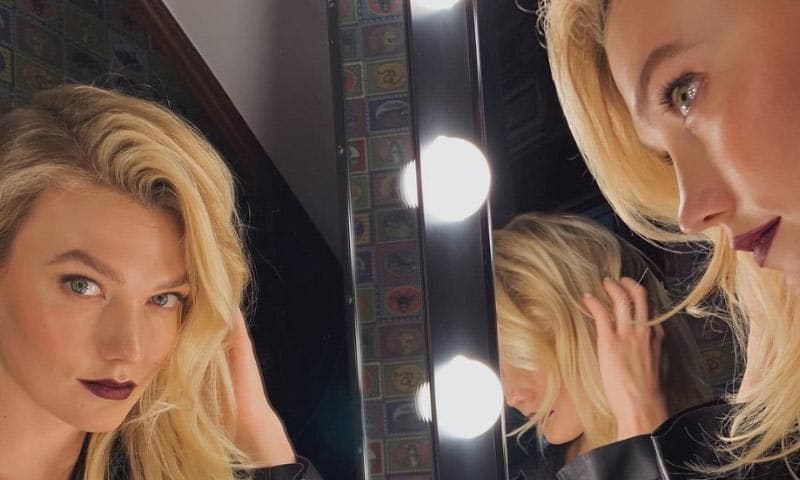 Karlie Kloss reflected in the mirror