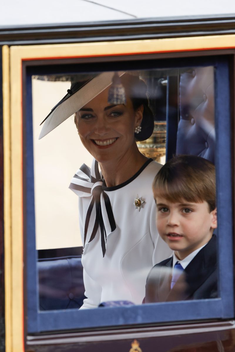 LONDON, ENGLAND - JUNE 15: Catherine, Princess of Wales and Prince Louis of Wales during Trooping the Colour at Horse Guards Parade on June 15, 2024 in London, England. Trooping the Colour is a ceremonial parade celebrating the official birthday of the British Monarch. The event features over 1,400 soldiers and officers, accompanied by 200 horses. More than 400 musicians from ten different bands and Corps of Drums march and perform in perfect harmony. (Photo by John Phillips/Getty Images)