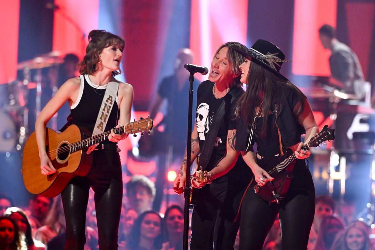 Anna Vaus, Keith Urban, and Maggie Baugh perform onstage at the 2024 CMT Music Awards held at the Moody Center on April 7, 2024