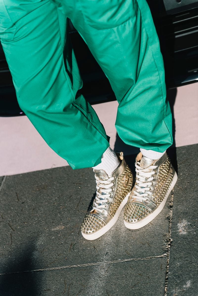 Studded Louboutin sneakers at Melbourne Fashion Festival.
