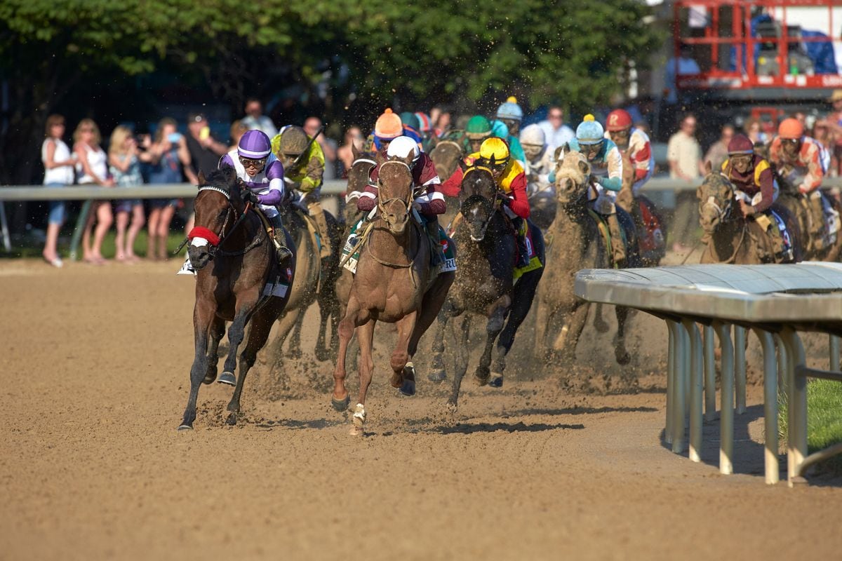 Mario Gutierrez aboard Nyquist (13) and Mike Smith aboard Danzig Candy (20) in action early in the Kentucky Derby at Churchill Downs, Louisville, KY (May, 2016)