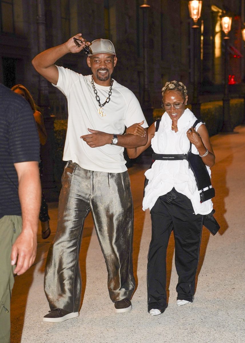 Walking arm-in-arm through the streets of Paris, Will and Jada showcased coordinated yet effortlessly relaxed style.
