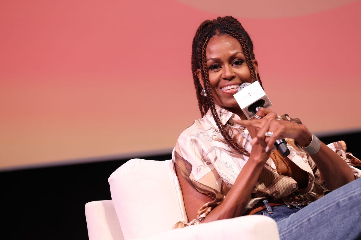 Michelle Obama wears burgundy figure-hugging bodycon with statement jewelry, continues stylish streak