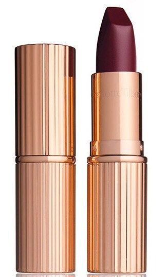 Encased in elegant gold, these lipsticks not only look beautiful on your countertop, but they're designed to give lips a full, matte effect. Plus, they include orchid extracts to hydrate and soften lips for a polished finish. Their square angled bullet keeps darker colors neat, too. The result? A classic but modern look inspired by the likes of Rihanna and Grace Jones. <br>
Charlotte Tilbury Matte Revolution Lipstick in 'Glastonberry', $32, at charlottetilbury.com