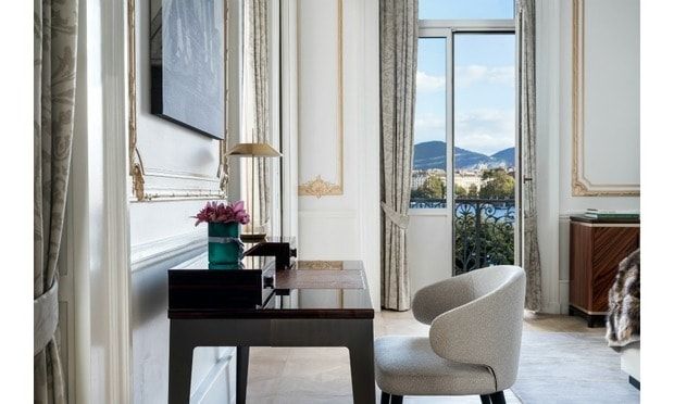 The 1,131-square-foot suite exudes opulence, featuring: a master bedroom, living room, dining room, kitchenette, two bathrooms, and dining room, all of which are decorated in a sophisticated style. Expertly designed in an art deco fashion, the suite is adorned with gold leaf details. Grace's suite also mirrors the actress's light nature, boasting high ceilings and large bay windows that bathe the entire space in sunshine.
Photo: Courtesy of The Ritz-Carlton Hotel de la Paix, Geneva
