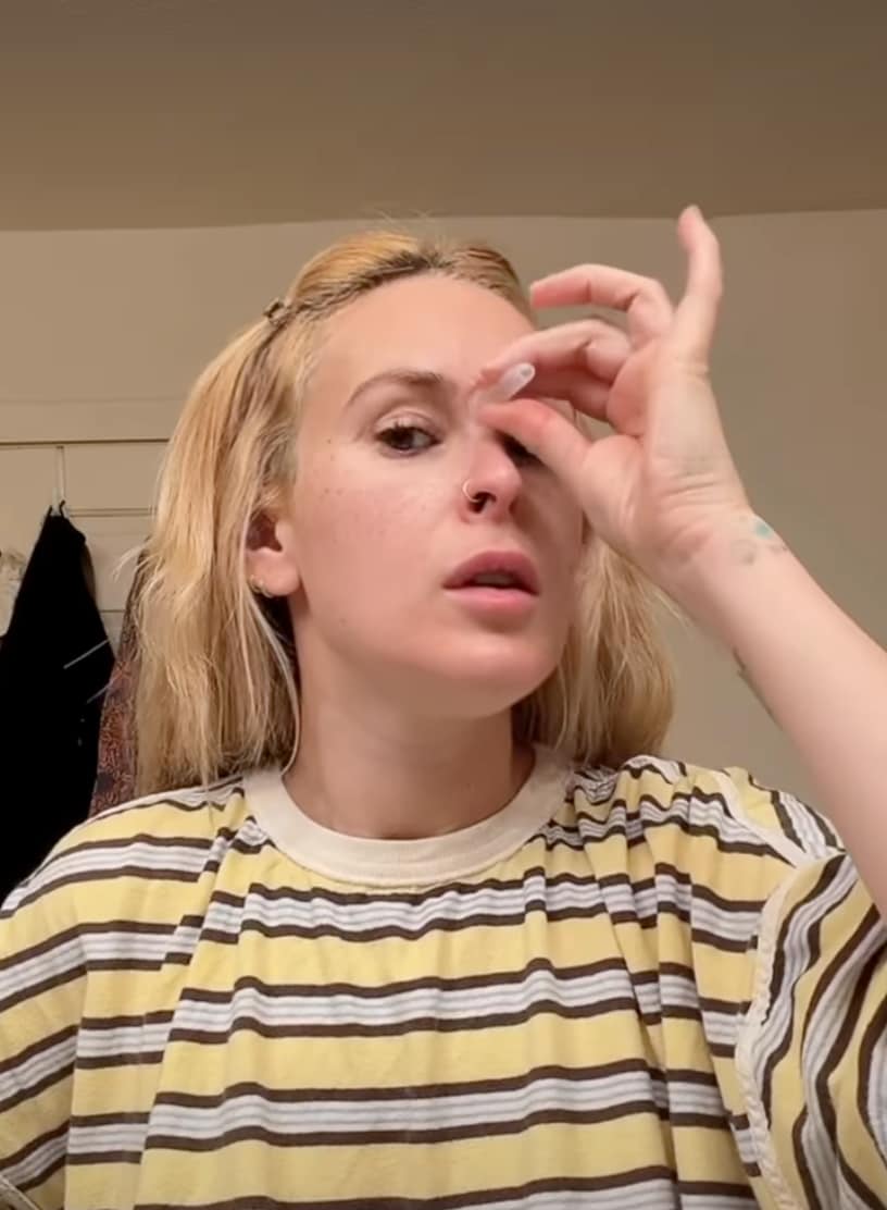 She starts with the nose and forehead area first. 