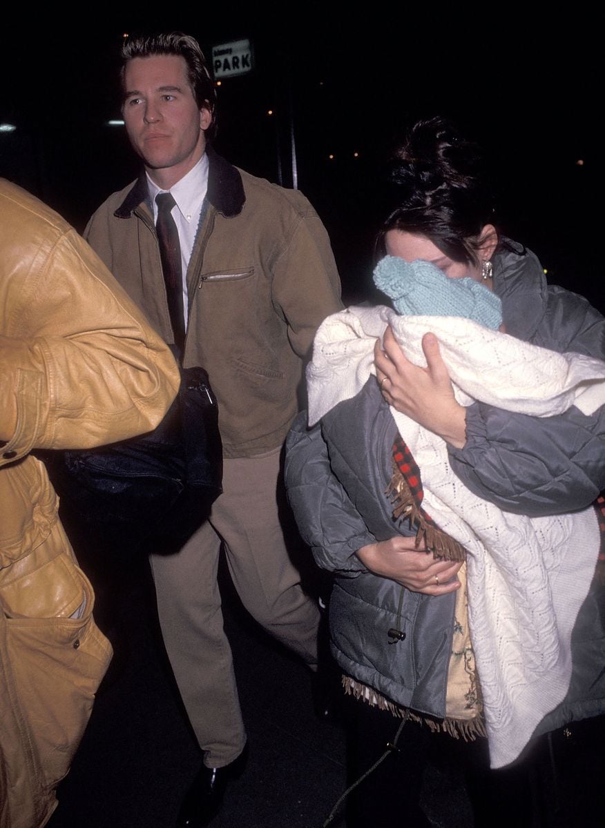 Actor Val Kilmer, actress Joanne Whalley, and daughter Mercedes Kilmer attend a preview performance of the Broadway play "Death and the Maiden" on February 20, 1992, at the Brooks Atkinson Theatre in New York City. 