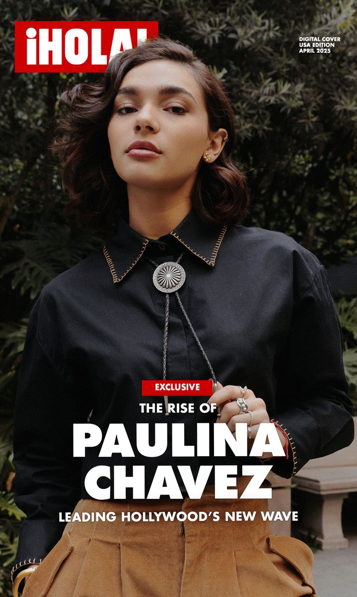 Paulina Chávez poses confidently in a black shirt with a silver bolo tie and tan trousers for ¡HOLA! USA’s April 2025 digital cover.