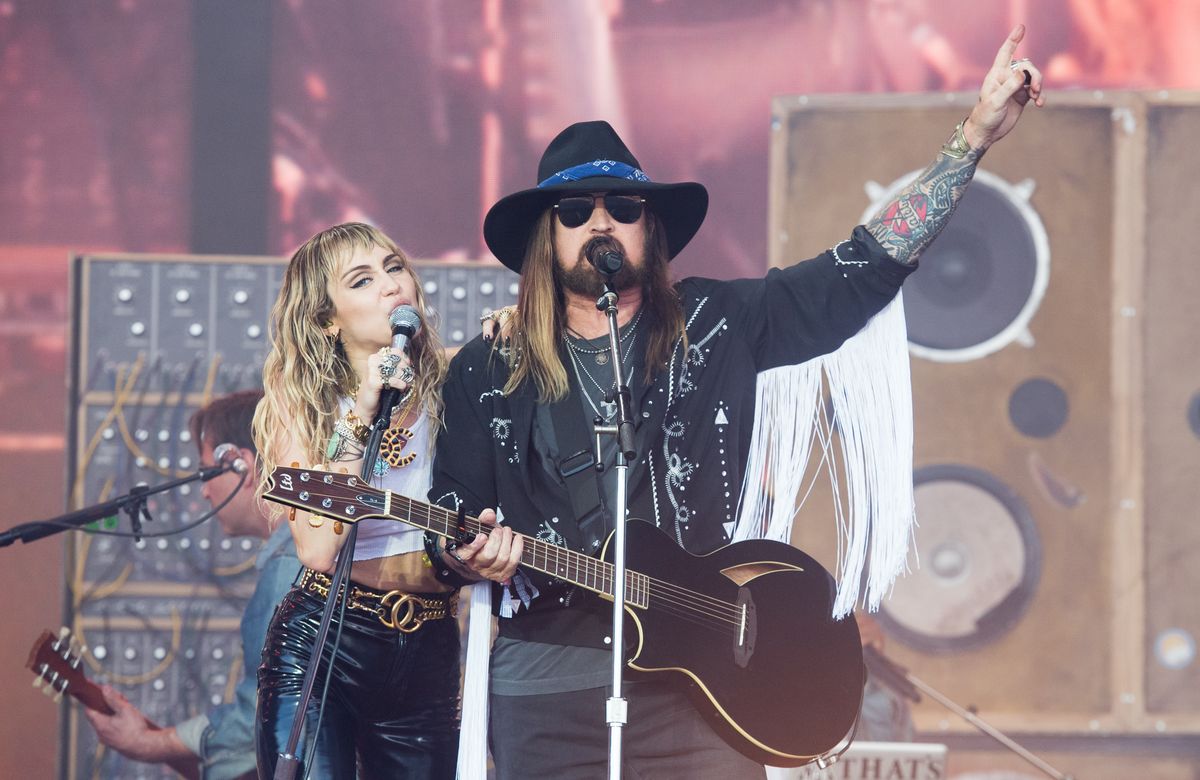  Miley Cyrus and Billy Ray Cyrus  perform on the Pyramid Stage during day five of Glastonbury Festival 