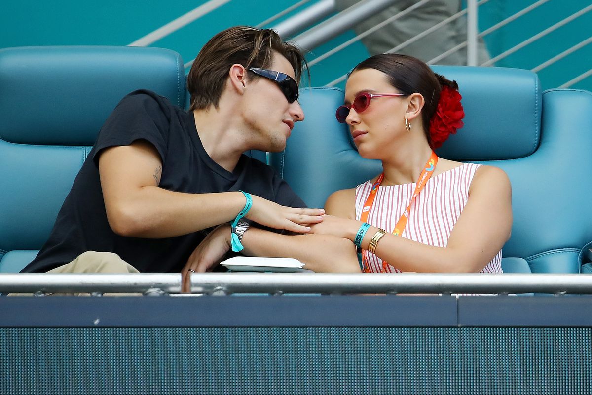 Jake Bongiovi, and Millie Bobby Brown attend the Novak Djokovic of Serbia and Sebastian Korda of the United States match on Day 10 of the Miami Open at Hard Rock Stadium on March 27, 2025 in Miami Gardens, Florida. (Photo by Leonardo Fernandez/Getty Images)