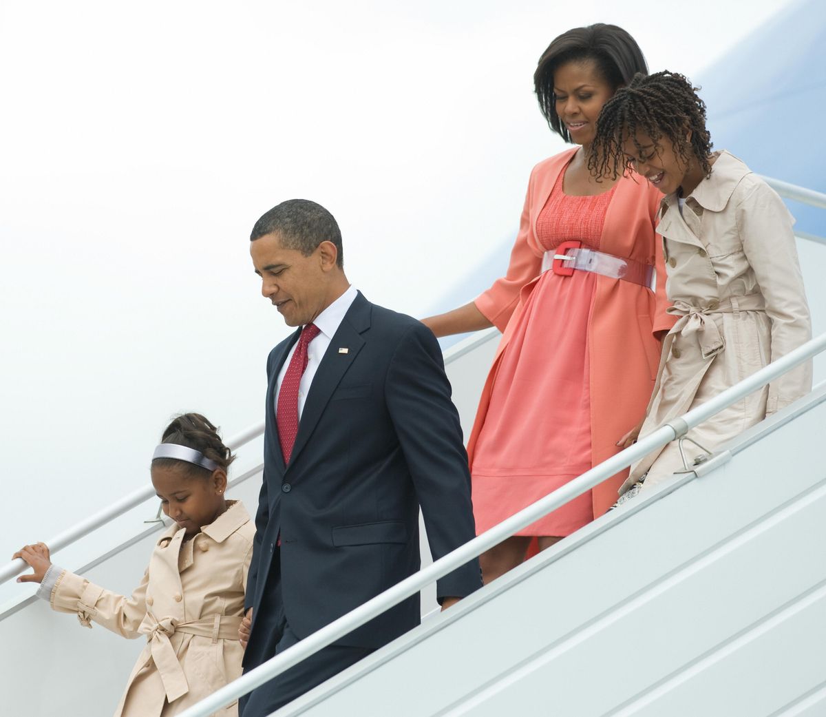 US President Barack Obama walks alongside First Lady Michelle Obama and daughters Sasha and Malia after arriving on Air Force One in Moscow on July 6, 2009.