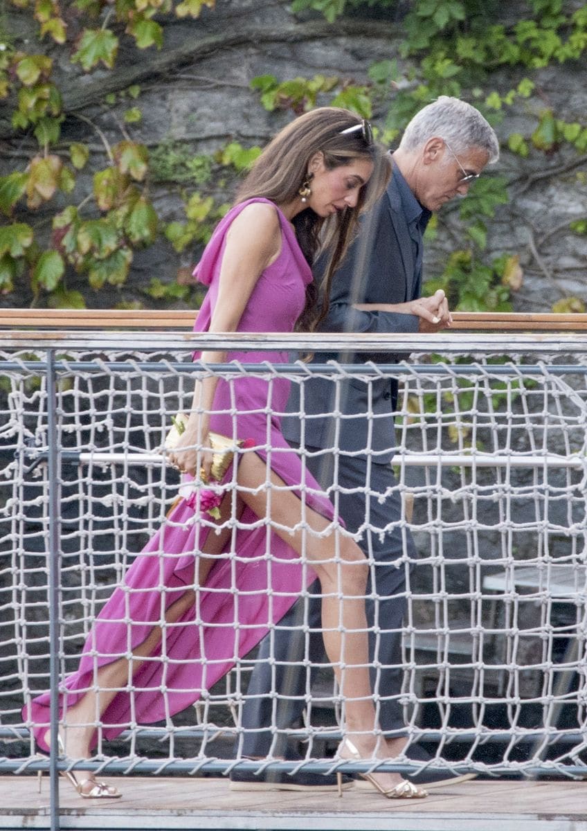 Before her magenta moment, Amal had already stolen the spotlight in a sequined silver gown by Badgley Mischka.