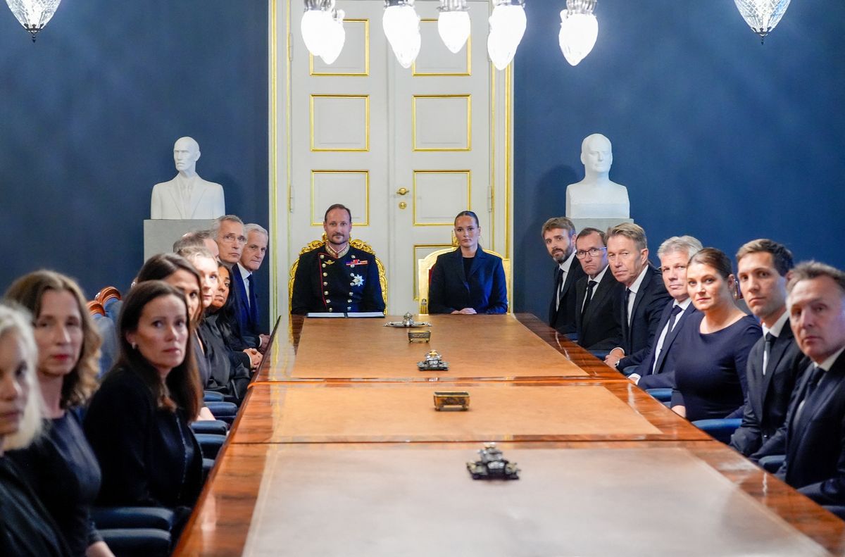 King Haakon of Norway (C, L) and Princess Ingrid Alexandra of Norway (C, R) sit at the head of the table for an extraordinary cabinet meeting at the Royal Palace, in Oslo on August 28, 2026, following the death of King Harald V of Norway.