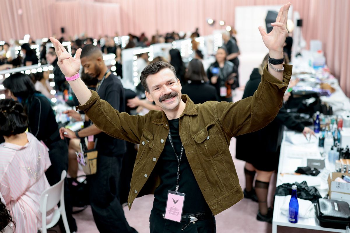 Adam Selman poses backstage at the Victoria's Secret Fashion Show