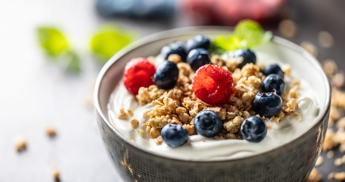 A yogurt bowl with fruit and granola