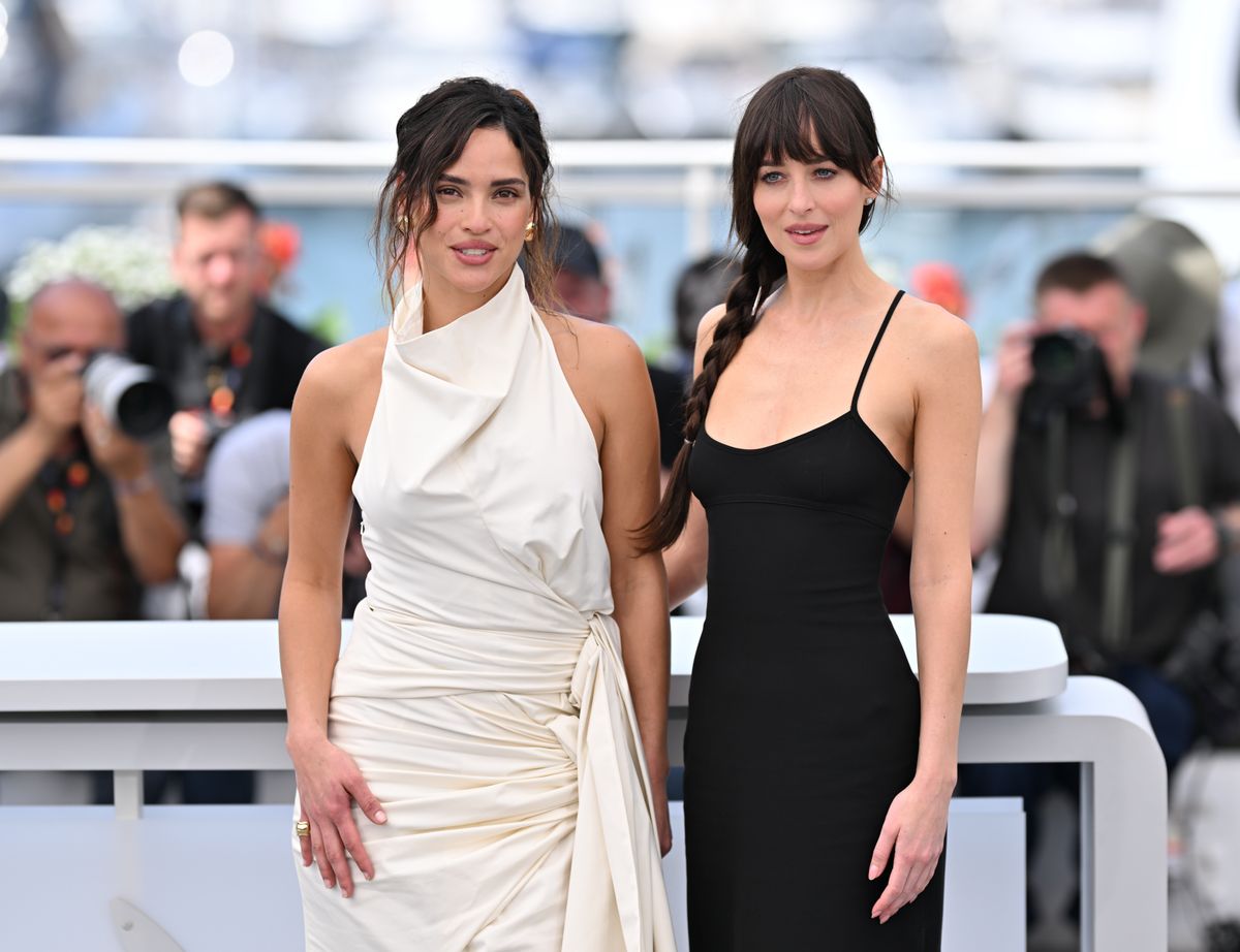 Adria Arjona (L) US actress Dakota Johnson (R) pose during a photocall for the film 'Splitsville' at the 78th edition of the Cannes Film Festival in Cannes, France on May 19, 2025. 