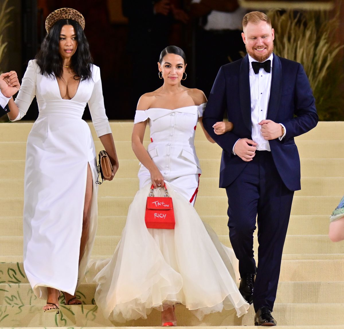 Aurora James, Alexandria Ocasio-Cortez and Riley Roberts leave the 2021 Met Gala Celebrating In America: A Lexicon Of Fashion at Metropolitan Museum of Art on September 13, 2021 in New York City. (Photo by James Devaney/GC Images)