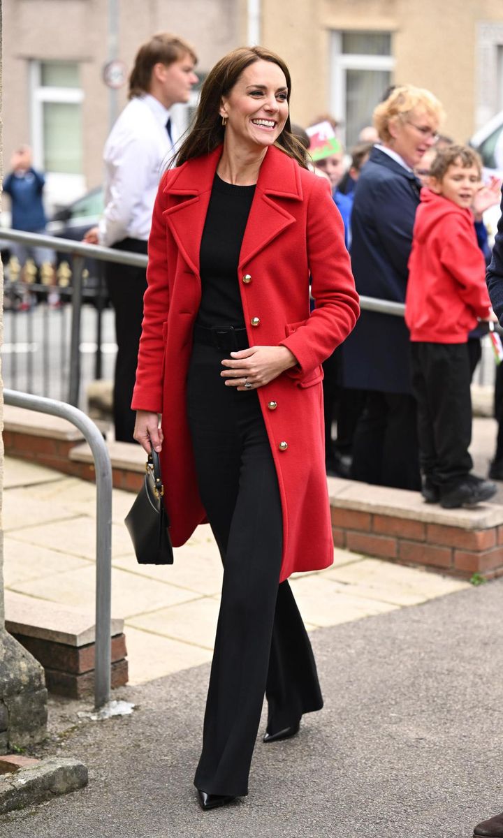 The royal mom of three looked radiant in a red LK Bennett coat.