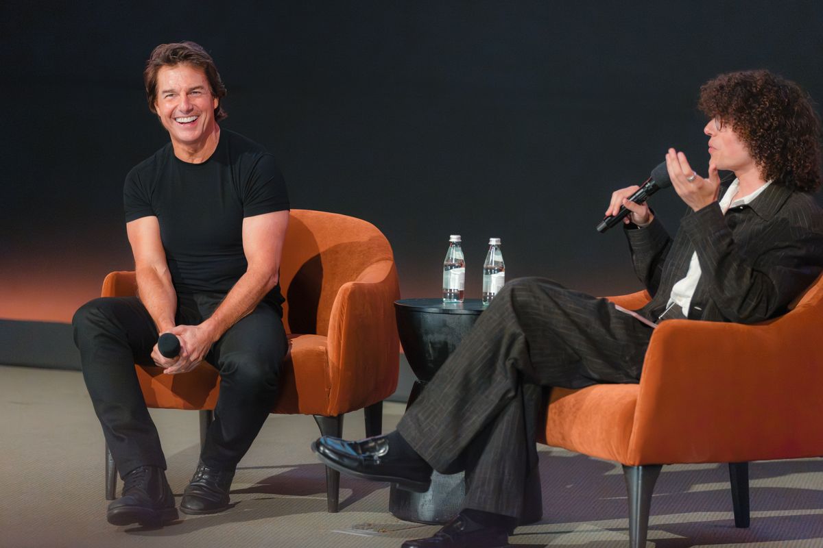 Tom Cruise and moderator Reece Feldman speak at the trailer launch event for "Digger"