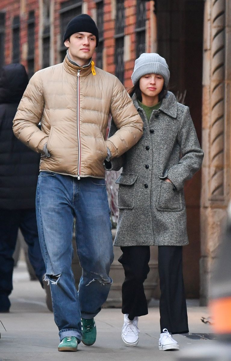 Olivia Rodrigo and Louis Partridge are pictured during a rare sighting in New York City. The 21 year old pop star wore a grey beanie, tweed coat, black trousers, and white trainers.