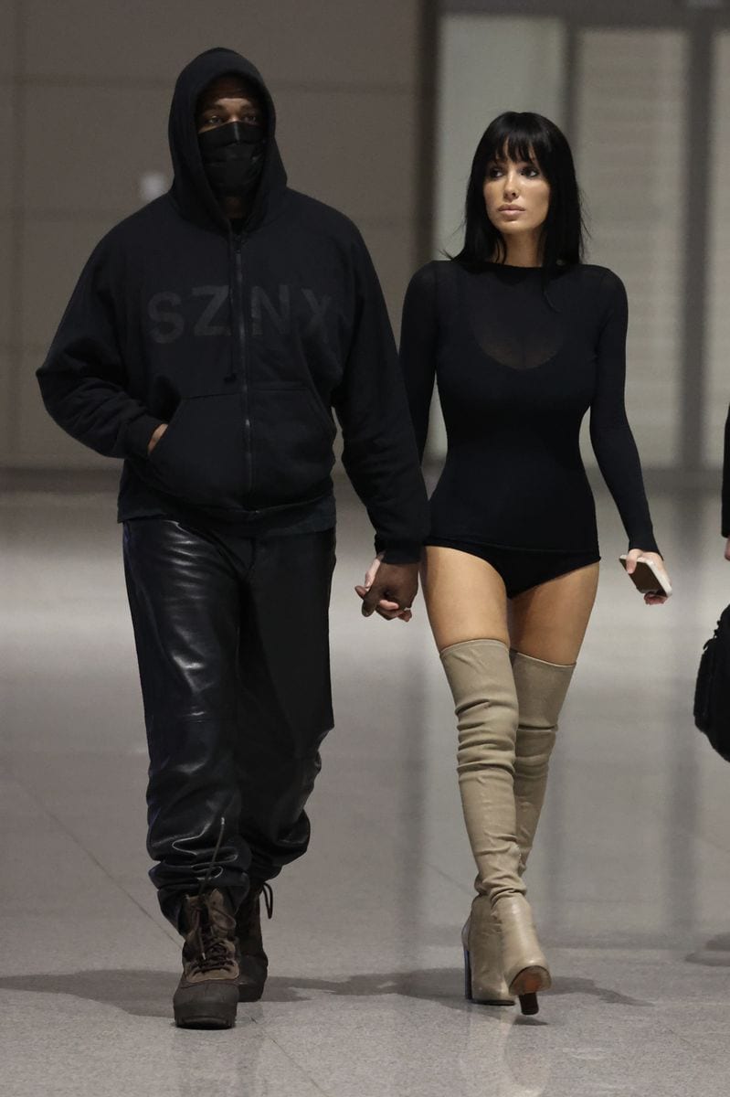 For the outing, Censori wore a semi-sheer black bodysuit paired with micro-length shorts.