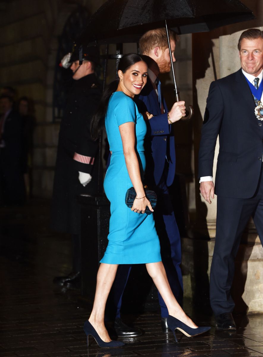 Meghan made a striking departure from her usual royal neutrals in a vibrant Victoria Beckham dress during her final engagements in 2020.