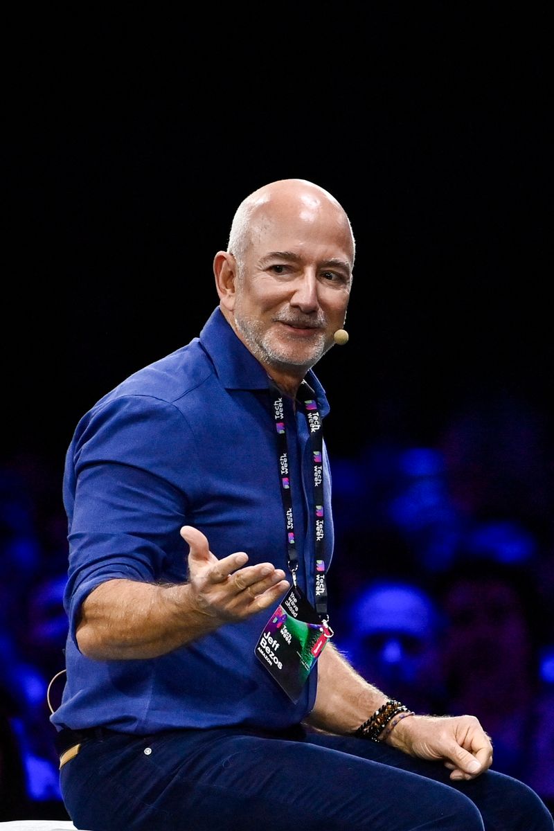Jeff Bezos Amazon's founder speaks with John Elkann Stellantis' Chairman on stage during the Italian Tech Week 2025 at OGR Officina Grandi Riparazioni on October 3, 2025 in Turin, Italy. (Photo by Stefano Guidi/Getty Images)