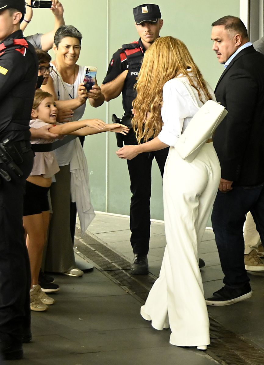 Shakira paused to embrace a young fan during her visit to Barcelona.