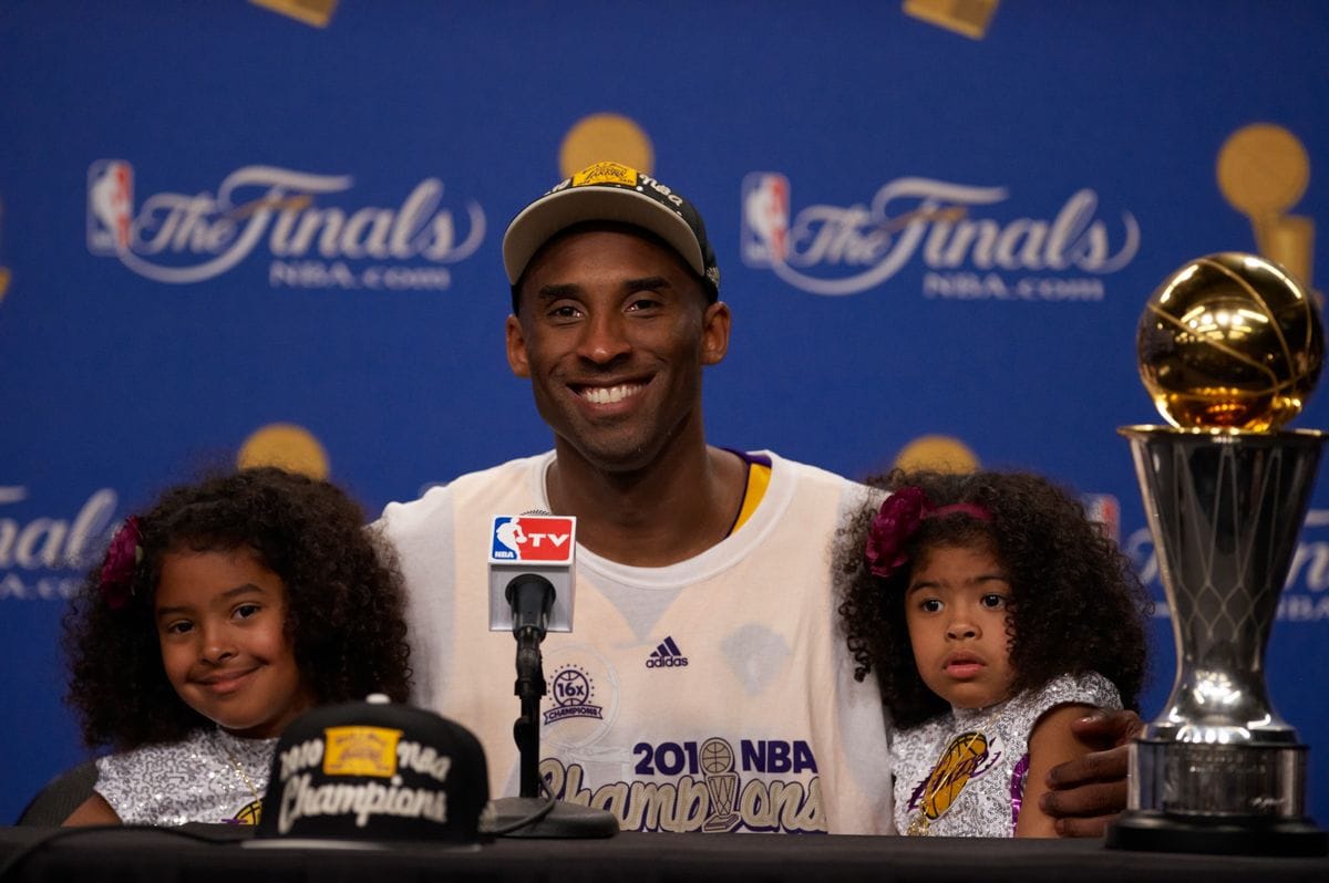 Kobe celebrating his Championship win with his daughters Natalia and Gigi