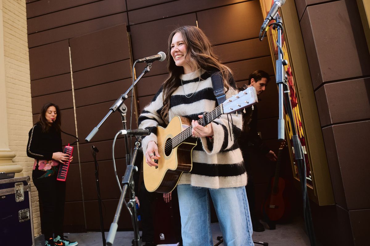 Joy Huerta performing a pop-up concert for 'Real Women Have Curves'