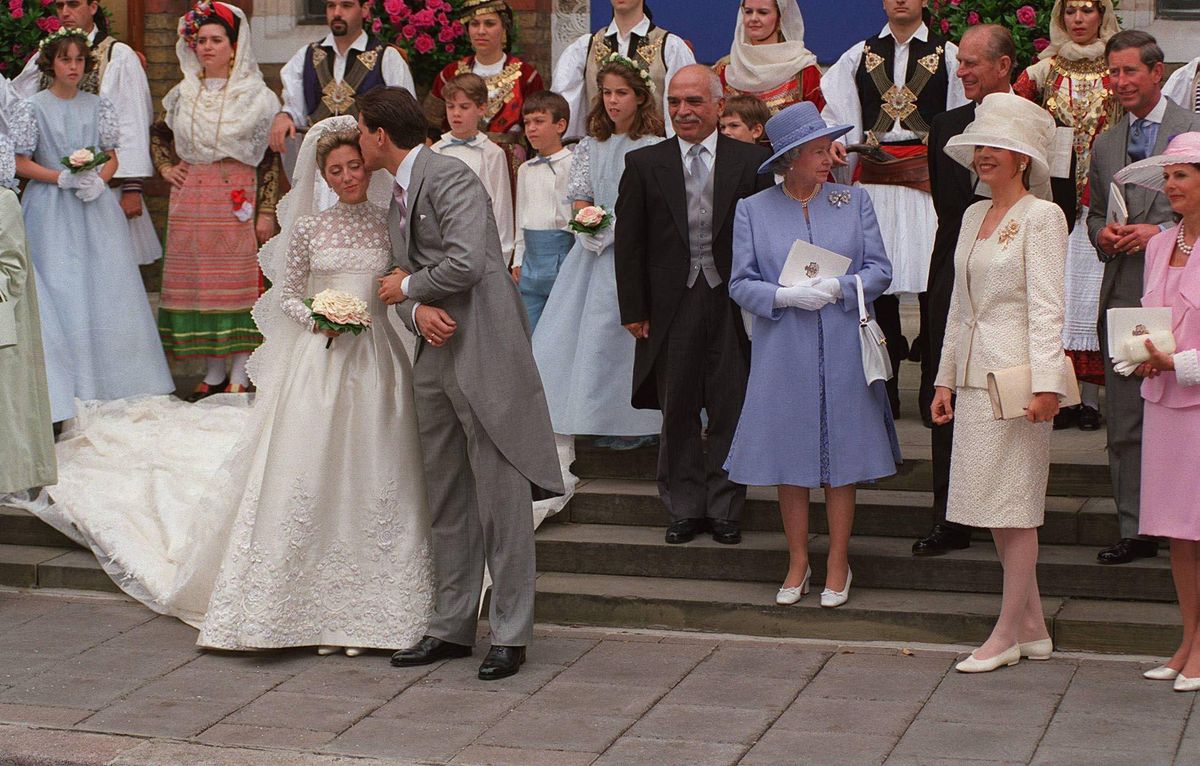 Crown Princess Marie-Chantal’s Valentino gown featured a lace bodice, long floral sleeves, and a veil embroidered with butterflies.