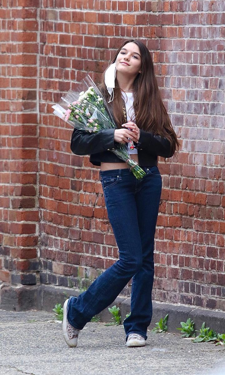 Suri Cruise in a leather jacket