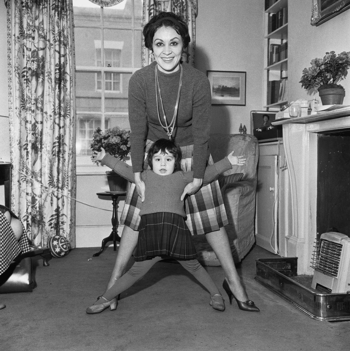 Chita Rivera playing with her daughter, Lisa Mordente, in London, England, 6th February 1962. 