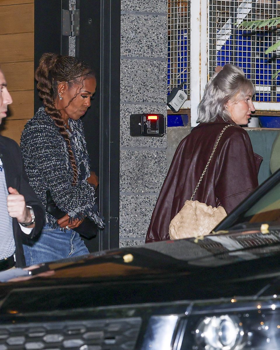 Michelle Obama was photographed during a girls' night out in Los Angeles with Megan Thee Stallion and La La Anthony, wearing a textured jacket and blue jeans.