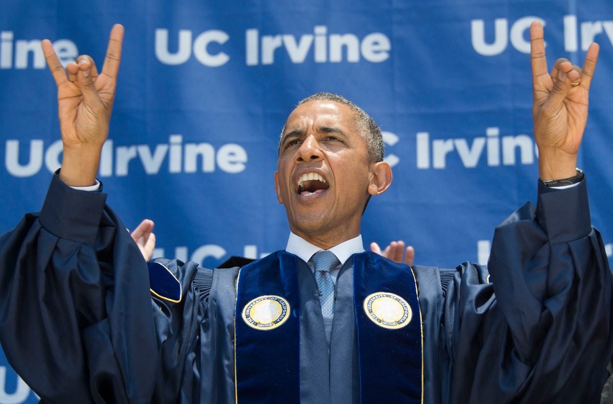 TOPSHOT - US President Barack Obama scream "Zot, Zot, Zot", as he makes the symbols of the Anteater, the mascot for the University of California-Irvine, after delivering the commence ment address in Irvine, California, June 14, 2014. The student chant "Zot, Zot, Zot!" is the sound made by the tongue of the anteater in the comic strip B.C. by cartoonist Johnny Hart as it flicks out to catch an ant.        AFP PHOTO / Jim WATSON (Photo by Jim WATSON / AFP) (Photo by JIM WATSON/AFP via Getty Images)