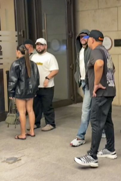 Bad Bunny embraced a casual off-duty look in a gray hoodie and relaxed denim as he enjoyed time with Berlingeri before returning to the stage.