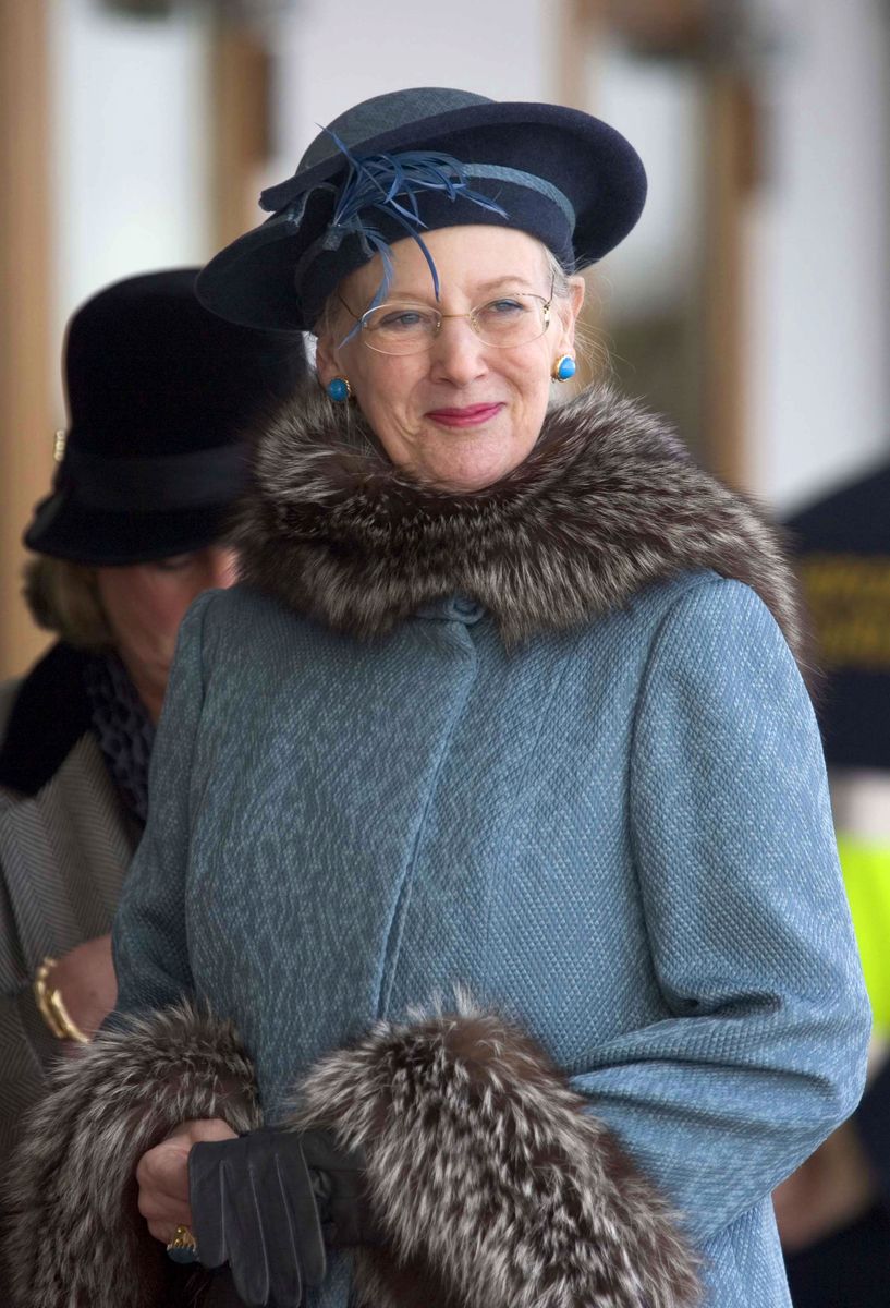 Queen Margrethe's royal monogram remained an important symbol of her reign, appearing on military flags and standards that represented the longstanding connection between the Danish Crown and its armed forces.