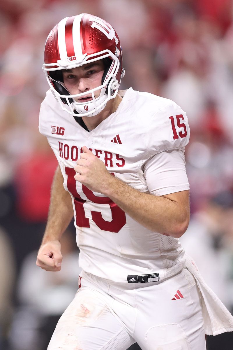Fernando Mendoza #15 of the Indiana Hoosiers celebrates a touchdown pass to Elijah Sarratt #13.