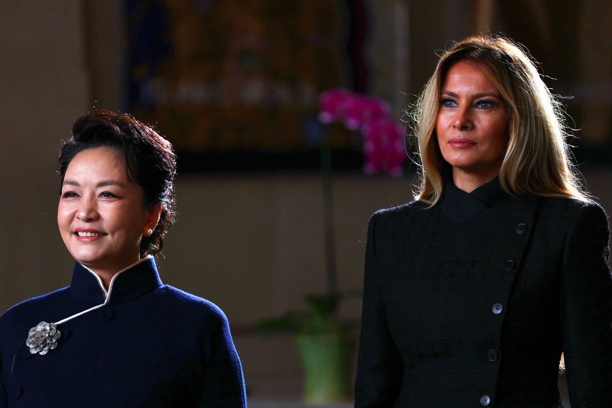 First Lady of China Peng Liyuan and U.S. First Lady Melania Trump listen as choir students from the Hope Chinese School perform during a visit to the Smithsonian National Museum of Asian Art in Washington, D.C.