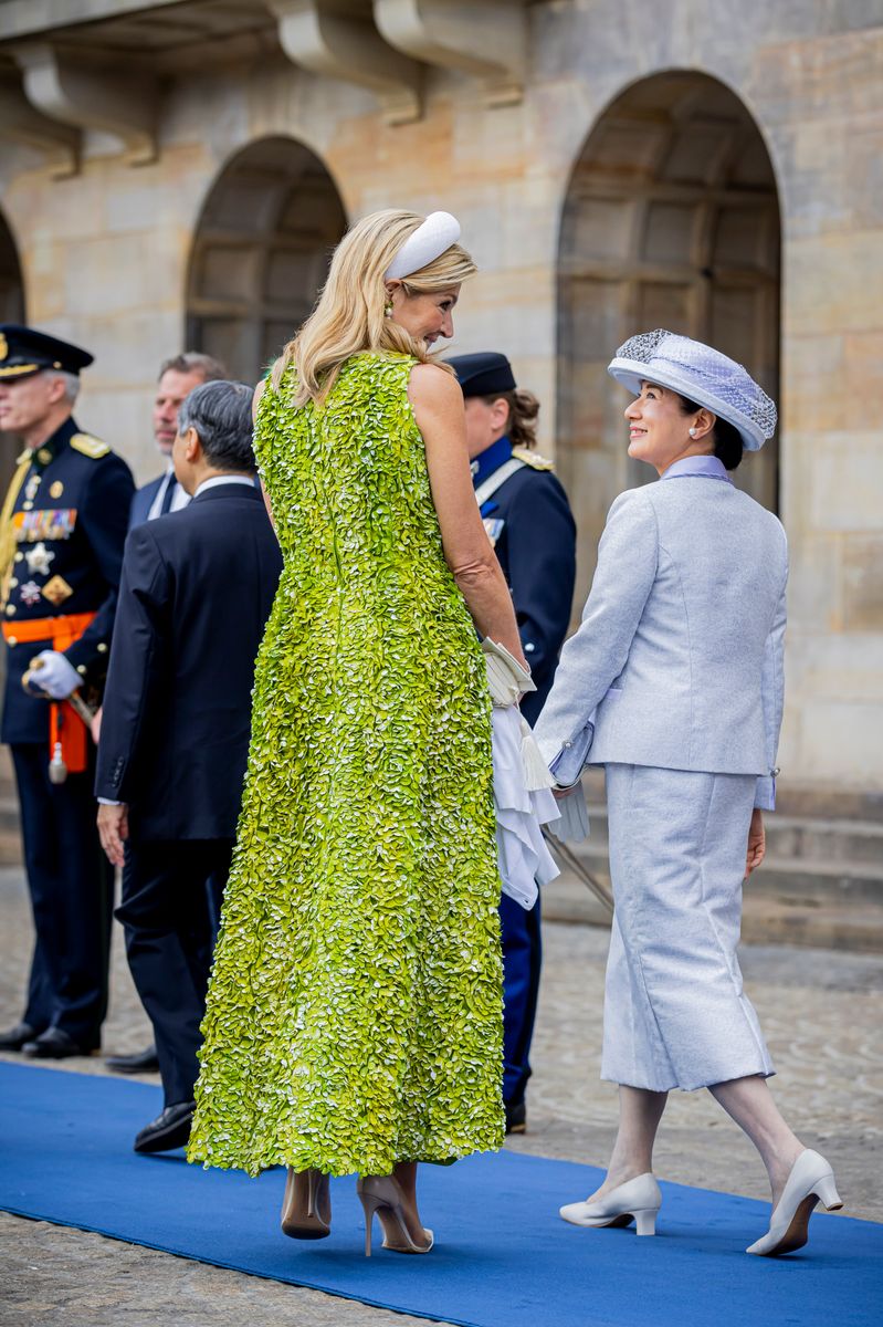 Queen Máxima and Empress Masako offered two distinct interpretations of diplomatic dressing during the official welcome in Amsterdam.