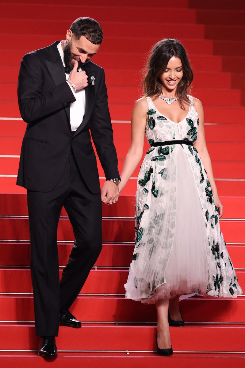    Ittihad's French forward #09 Karim Benzema (L) and Algerian-French actress Lyna Khoudri leave after the screening of the film "13 jours, 13 nuits" (13 Days, 13 Nights) at the 78th edition of the Cannes Film Festival in Cannes, southern France, on May 23, 2025. (Photo by Sameer Al-Doumy / AFP) (Photo by SAMEER AL-DOUMY/AFP via Getty Images)       