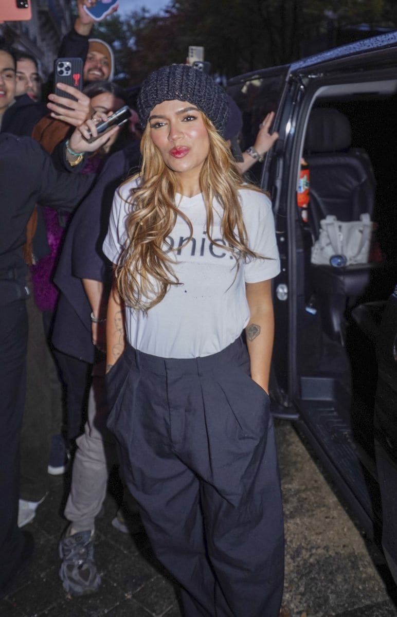 

Karol G is pictured taking photos with fans ahead of her performance at Crazy Horse in Paris. 